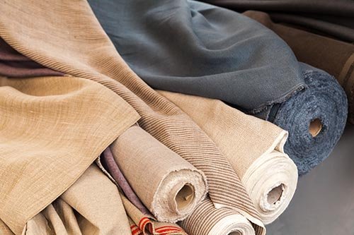 rolls of natural linen cloth